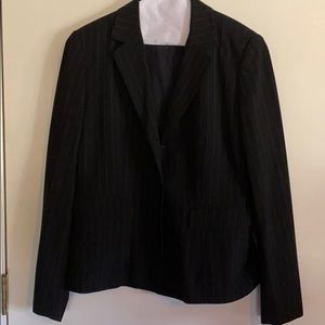 Black business suit with small white stripes